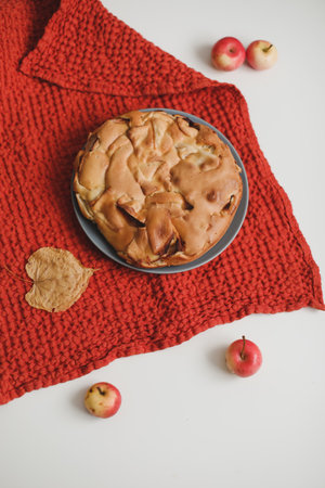 Homemade Apple Pie on white table background, top view. Classic autumn Thanksgiving dessert - organic apple pie.の写真素材
