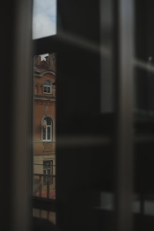 View of the city from the window. Tile roofs over historical city center. Travel concept.