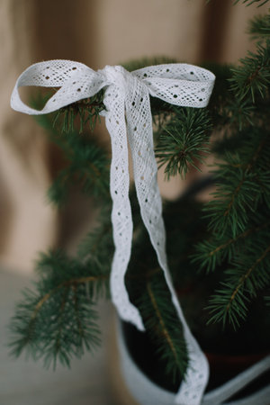 New Year lace decorations for the Christmas tree in eco style. Zero Waste Christmas concept. Vintage Christmas tree decorations. Holiday Template with Christmas decorations on fir treeの写真素材
