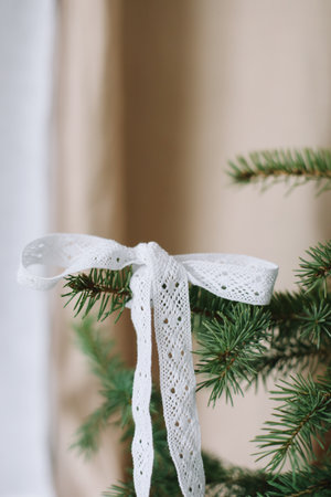 New Year lace decorations for the Christmas tree in eco style. Zero Waste Christmas concept. Vintage Christmas tree decorations. Holiday Template with Christmas decorations on fir treeの写真素材