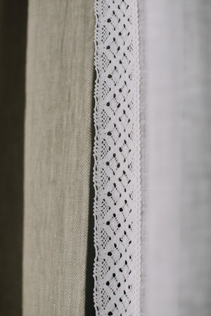 Lace frame close up isolated on Fabric texture. transparent linen curtain. Pattern, texture. Curtain at window, selective focus. vintage styleの写真素材