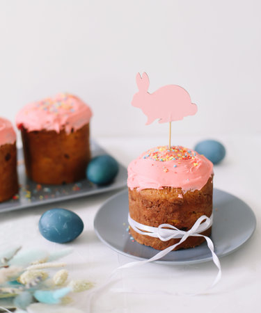 Easter Cake and Pastries, Blue Eggs and willow branches.Traditional Easter powdered sugar pastries,...