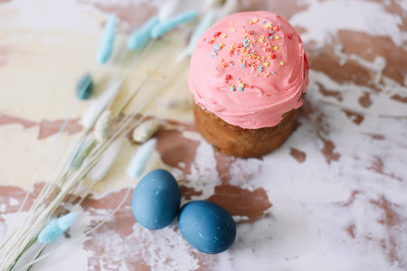 Easter Cake and Pastries, Blue Eggs and willow branches.Traditional Easter powdered sugar pastries,...