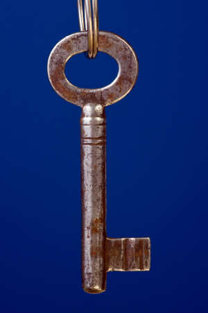 key for door lock on blue background の写真素材