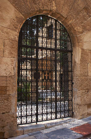 medieval gate with grid in Rhodes, Greeceの写真素材