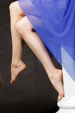 Dancer in a blue dress in the studioの写真素材