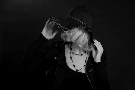 A lady in a black hat