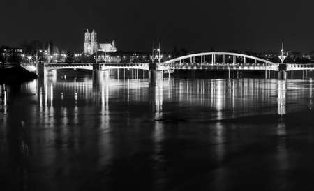 river and bridge by night in Poznan, Polandの写真素材
