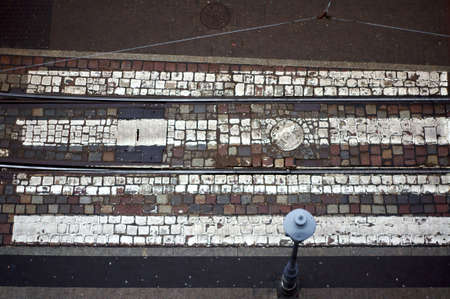 The pedestrian crossing on a cobblestone street in Poznan 
