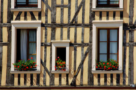 house in Troyes and Windows decorated with flowers, France の写真素材