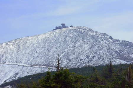 Snow-covered mountain slope and shelter in the Giant Mountains, Polandの写真素材
