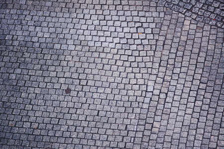 Granite paving stones in the street in Poznanの写真素材