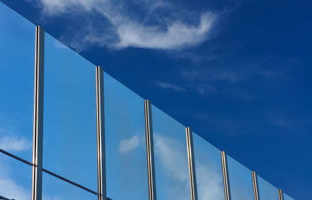 Transparent baffle against the blue sky