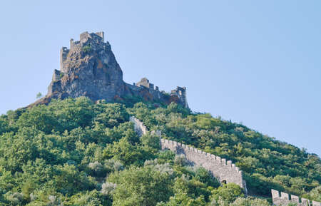 Stone ruins of a medieval castle on a hilltop in Franceの写真素材
