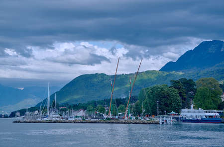 Yachts in the port town of Evian-les-Bains on Lake Geneva in Franceの写真素材