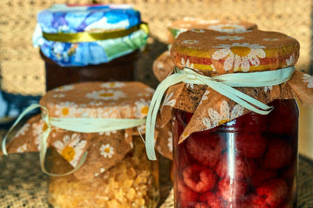 Jars with raspberries seasoned winter