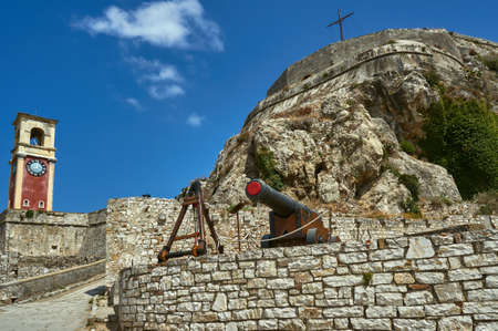 Clock tower and cannon in Palaio Frourio, city of Corfu, Greeceの写真素材