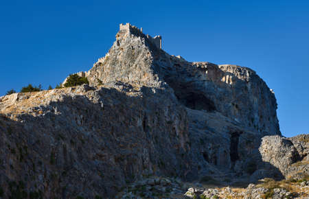 Medieval fortifications on top of the rock in Lindosの写真素材