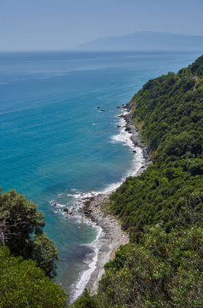 Rocks, cliff and forest on the coast of the Aegean Sea in Greeceの写真素材