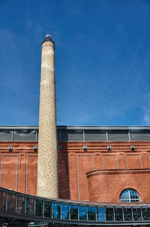 The chimney of a brick in an old brewery in Poznanの写真素材