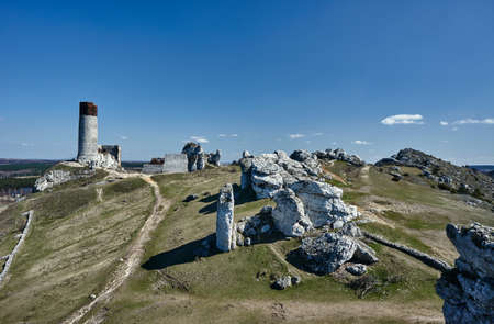 white rocks and ruined medieval castle in Olsztyn, Polandの写真素材