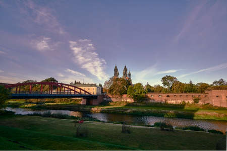 Urban landscape of the Warta river, the bridge and the towers of the cathedral in Poznanの写真素材