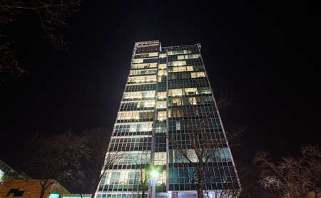 Night view of modern office building in Poznan