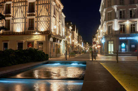 Night view of the fountain and street in the center of Troyes in Franceの写真素材