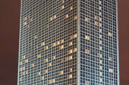 The facade of a skyscraper in Berlin at nightのeditorial素材