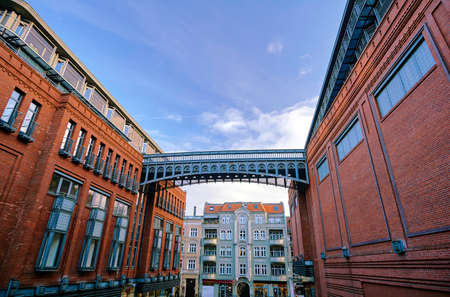 The metal structure and brick walls in an old brewery in Poznanの写真素材
