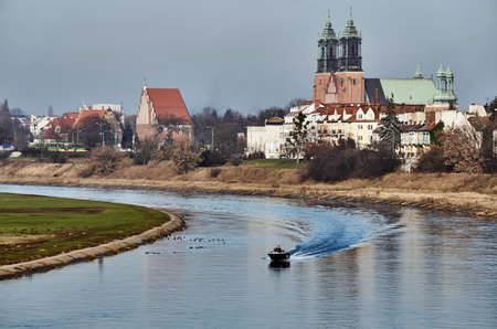 Motorboat and bridge over the river Warta in Poznanの写真素材