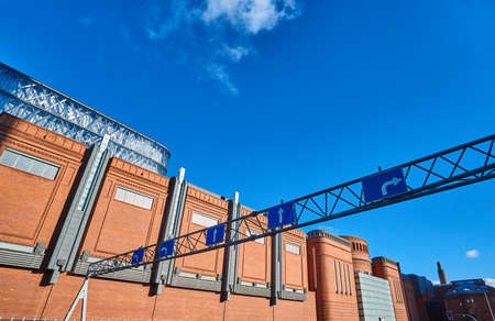The metal structure with road sign and brick wall in an old brewery in Poznan