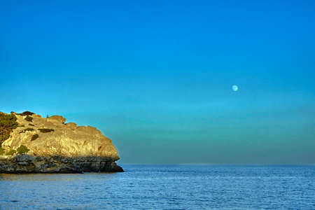 rocky cliff at the edge of the Mediterranean Sea, on the island of Rhodesの写真素材