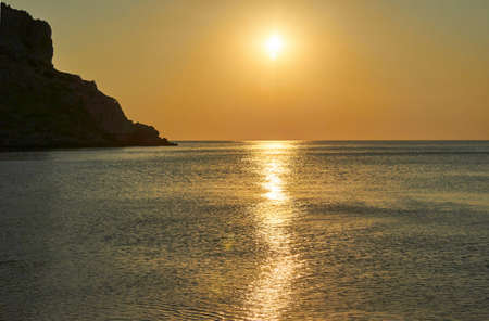 Sunrise over the Mediterranean Sea on the island of Rhodesの写真素材