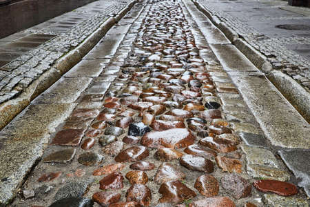 Granite cobblestones on a street in Poznanの写真素材