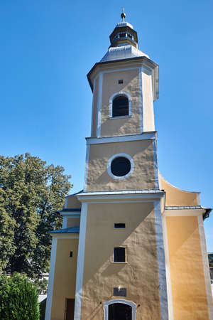 The church tower with a clock in Bystrzyca Klodzka in Poland