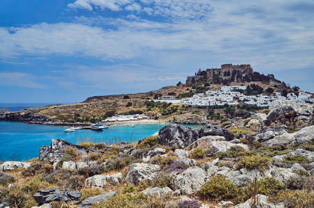 Medieval fortress and white houses of Lindos village in Rhodesの写真素材