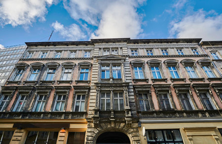 A facade of an Art Nouveau townhouse next to a modernist building in Poznanのeditorial素材