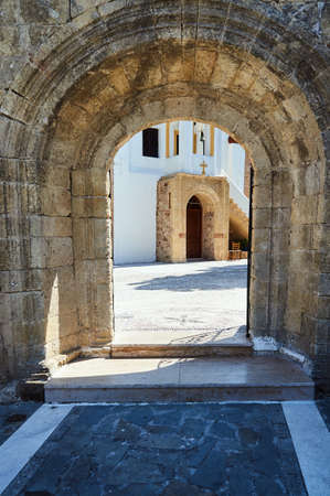 Stone portal and courtyard of the Orthodox monastery on the island of Rhodesの写真素材