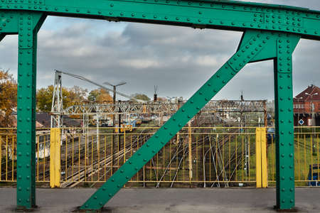 The steel construction of the road bridge over the railway tracks in Gnieznoの写真素材