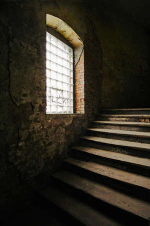 Wooden stairs of an old tenement house in Poznanの写真素材