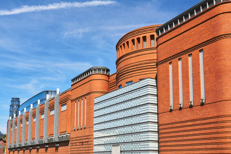 The metal structure and brick wall in an old brewery in Poznanのeditorial素材