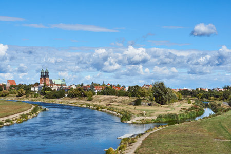 Urban landscape with river Warta and the cathedral towers in Poznan