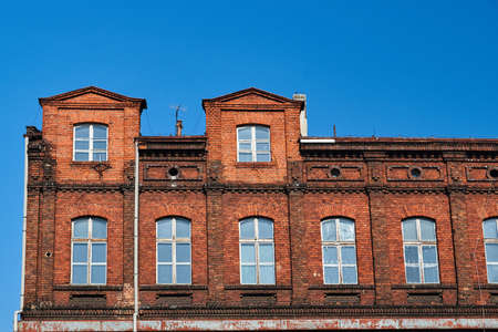 fragment of the facade of a brick building in Poznanの写真素材
