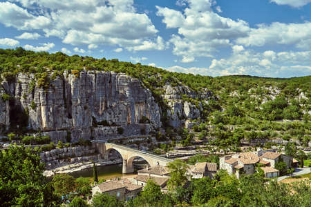 Stone bridge over the River Ardeche in the village of Balazuc in Franceの写真素材