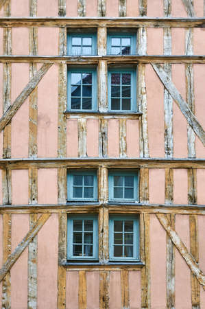 windows of a historic, timber-framed building in Troyes, Franceの写真素材