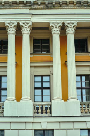 A fragment of the facade of a historic building with Corinthian columns in Poznanの写真素材