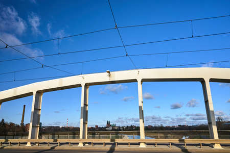 Steel structure of road bridge over the Warta river in the city of Poznanの写真素材
