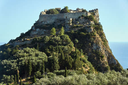 ruins of medieval castle on rock at Corfu island, Greece