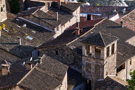 Roof tiles on stone roofs of historic houses in the town of Vogue in Franceの写真素材